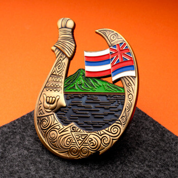 Custom fishhook challenge coin featuring Hawaiian flag, mountain landscape, and intricate tribal patterns.