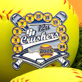Softball trading pin for 12u Crushers featuring crossed bats, player numbers on softballs, and 2025 logo on a home plate background.