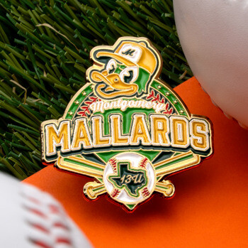 Montgomery Mallards baseball lapel pin featuring a duck mascot, baseball bats, and a Texas state outline on grass with baseballs.