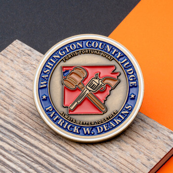Washington County Judge Patrick W. Deakins challenge coin featuring a gavel and revolver over a red state map outline.