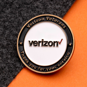 Round Verizon Veterans challenge coin with black and white enamel featuring the Verizon logo and the text Thank you for your service.