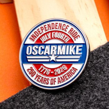Oscar Mike Independence Ride July Fourth challenge coin celebrating 250 years of America with red, white, and blue enamel.