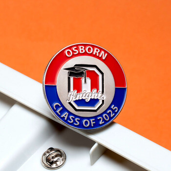 Circular enamel lapel pin for Osborn Knights Class of 2025 featuring a graduation cap and varsity letter emblem.