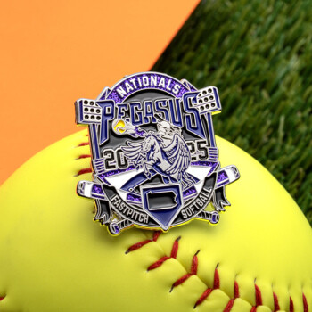 A purple and silver Pegasus Nationals 2025 Fastpitch Softball trading pin featuring a winged horse and a softball player, displayed on a yellow softball.